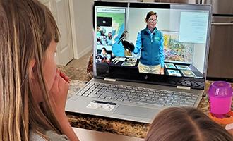 Children watching Educator on laptop